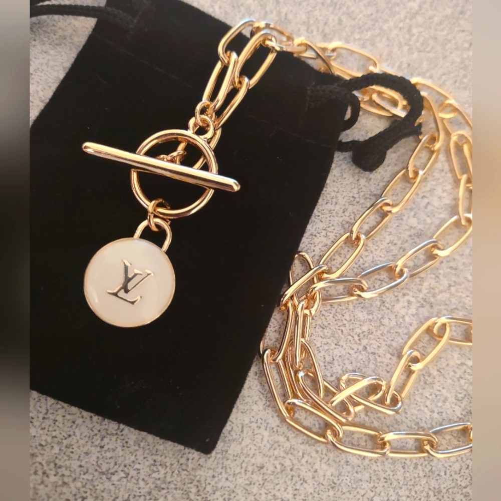 White and gold pendant link chain necklace .